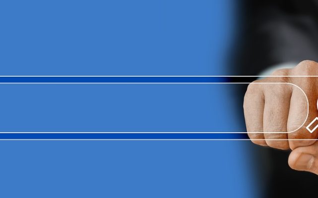 Windows 任务栏右下角的输入法状态图标，旁边弹出中英文切换菜单，桌面背景为深色壁纸
